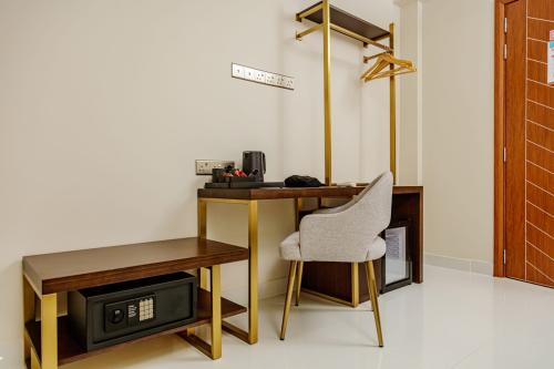 Desk, chair and in-room safe in the Deluxe Double Room