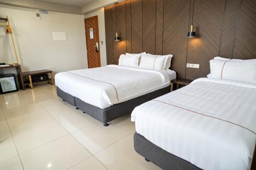 Two double beds in the Deluxe Family Room